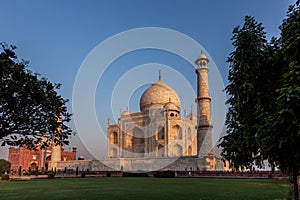 Taj Mahal in morning light with the inscription of the coran in arabic letter meaning in english: This is an invitation to live on
