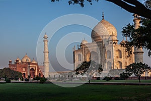 Taj Mahal in morning light with the inscription of the coran in arabic letter meaning in english: This is an invitation to live on