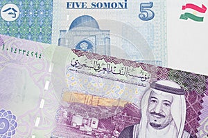 Tajik money close up with Saudi Arabian money