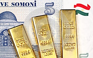 Tajikistan five somoni bank note with three gold bars