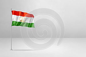 Tajikistan flag isolated on white concrete wall background