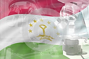 Tajikistan science development conceptual background - microscope on flag. Research in microbiology or medicine, 3D illustration