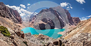 Tajikistan, view from the rock to Great Allo lake with narrow valley among Fan mountains