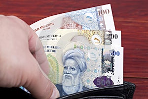 Tajikistani money - somoni in the wallet