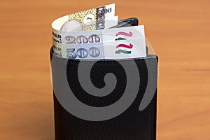 Tajikistani somoni in the black wallet
