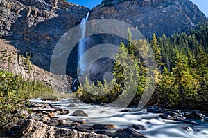 Takakkaw Falls and Yoho River in a sunny summer day. Yoho National Park, Canadian Rockies.