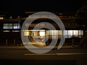 Takayama Old Town, JAPAN - April 11, 2014:  Night view of Sannomachi Street in Takayama ,with old wooden buildings and houses