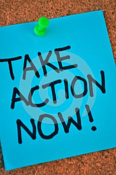 Take Action Now Note On Pinboard photo