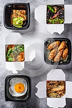 Take away food. Spring rolls, dumplings, gyoza and wok noodles. Healthy lunch. Take and go organic food. White background. Top