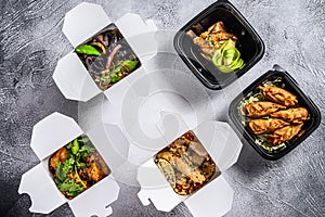 Take away food. Spring rolls, dumplings, gyoza and wok noodles. Healthy lunch. Take and go organic food. White background. Top