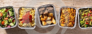 Take away healthy food in foil boxes photo