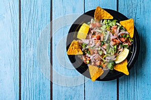 Take Away Mexican Food Pico De Gallo Salsa Salad with Tortilla Nachos, Tomato, Onion, Lime, Cilantro, Parsley, Jalapeno Pepper in