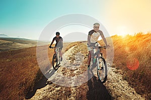 Take biking to a whole new level. two cyclists out cycling in the countryside.