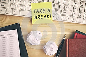 Take a break text on yellow paper