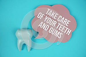 Take Care Of Your Teeth And Gums text on speech bubble with white tooth model on blue background