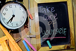 Take Care of Yourself on phrase colorful handwritten on chalkboard