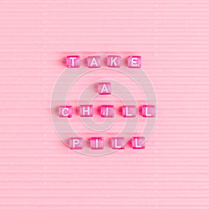 TAKE A CHILL PILL beads text typography