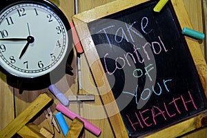 Take Control of your health on phrase colorful handwritten on chalkboard