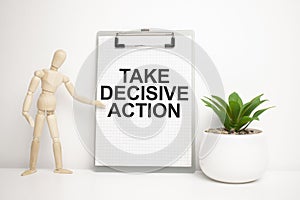 TAKE DECISIVE ACTION sign on small wood board rest on the easel with medical stethoscope