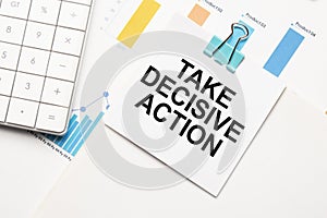 TAKE DECISIVE ACTION text concept. Office workplace table with calculator, graphs, reports and the text Budget 2021 on a small