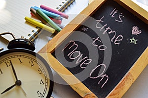 Take the first step phrase colorful handwritten on chalkboard, alarm clock with motivation and education concepts.It`s time to mov