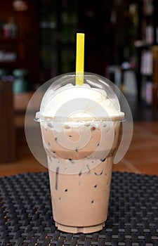 Take-home cup of ice coffee .