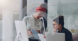 Take a look at this.... Cropped shot of two attractive young businesswomen working together in the office.