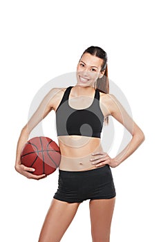 Take me on in a game of one on one. Cropped portrait of a young female basketball player against a white background.