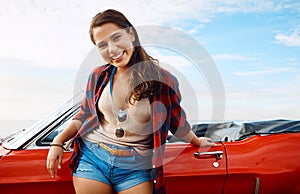 Take me somewhere beautiful. a happy young woman enjoying a summers road trip.