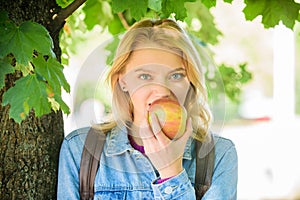 Take minute to relax. Break for snack. Student eat apple fruit nature background defocused. Healthy snack. Girl student