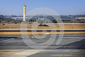 Take-off and landing runways with the control tower at Johannesburg International Airport in South Africa