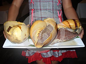 Take out dishes in the shells of giant snails