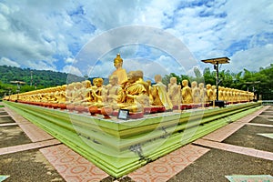 Take photo of  Buddha statue sitting   image of 1250 monks chant around the Buddha image at  Phuttha Utthayan Makha Bucha Anusorn