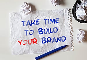 TAKE TIME to build your brand lettering on white crumpled paper