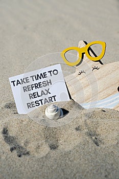 TAKE TIME TO REFRESH RELAX RESTART text on paper greeting card on background of funny starfish in glasses summer