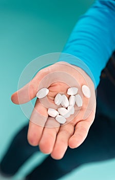 Take your pills. Pills on human hand. Prescribed and dispensed pills. Pills for flu and cold. Tablets and drugs. Health