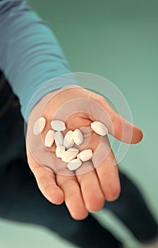 Take your pills. Pills on human hand. Prescribed and dispensed pills. Pills for flu and cold. Tablets and drugs. Health