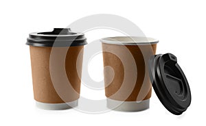 Takeaway paper coffee cups with lids on white background