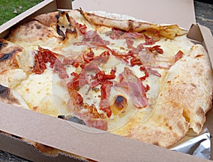 Takeaway Pizza In a Delivery Box Dried tomatoes mozzarella pancetta