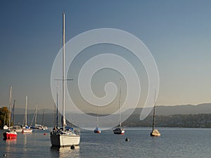 Taken from the quay Quaianlagen, leisure boats on Lake Zurich / ZÃÂ¼richsee at sunset