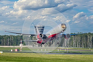 Takeoff of a Boeing 777-300 of ROSSIYA airlines in a livery depicting the muzzle of an Amur leopard from Vnukovo airport