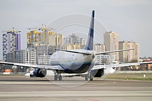 Takeoff runway of Kyiv International Airport, Zhuliany. Plane of YanAir company is prepared for takeoff.