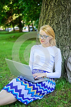 Taking advantages of freelance. Girl sit grass lean tree trunk with notebook. Wi fi network connection free access. Lady