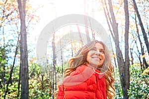 Taking in the beauty of autumn. an attractive young woman in the forest during autumn.