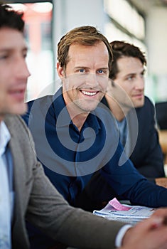 Taking care of business. business people around a table.