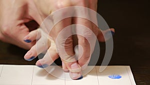 Taking fingerprints. fingerprint on a white sheet