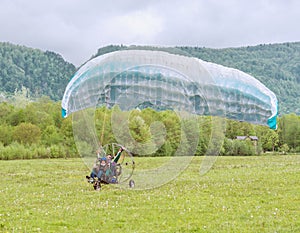 Taking off the paraglider.