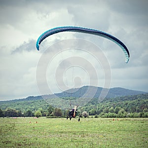 Taking off the paraglider.