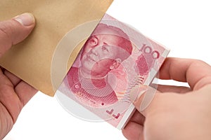 Taking out stack of RMB paper currency from envelope with clipping path