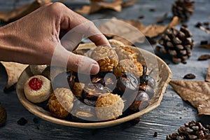 Taking a panellet, typical confection of Catalonia